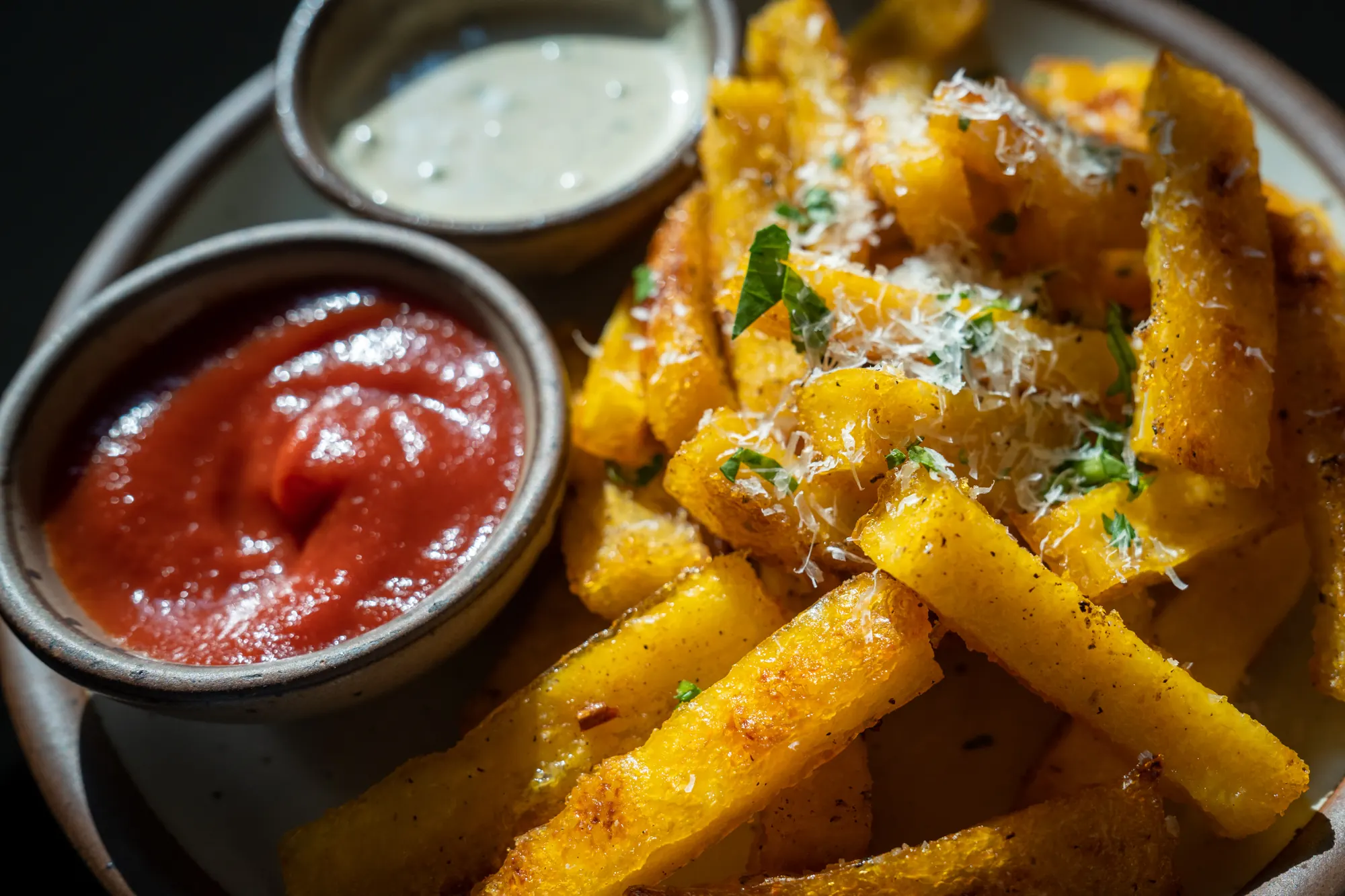 Baked polenta fries with parmesan, marinara and a creamy dip.