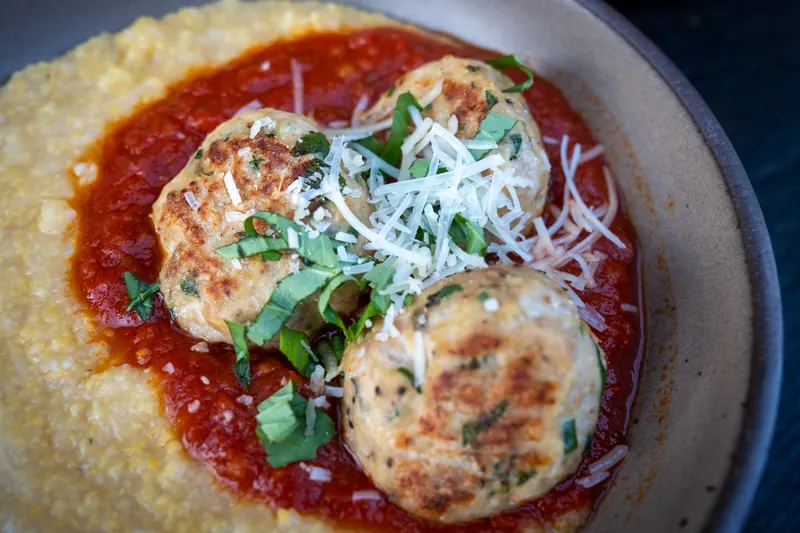 Creamy polenta with turkey meatballs, marinara and parmesan.